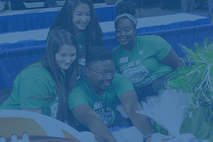 Four students pose for a selfie.